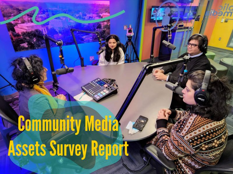 Four people sitting around a podcast table with microphones with Community Media Assets Survey Report graphic