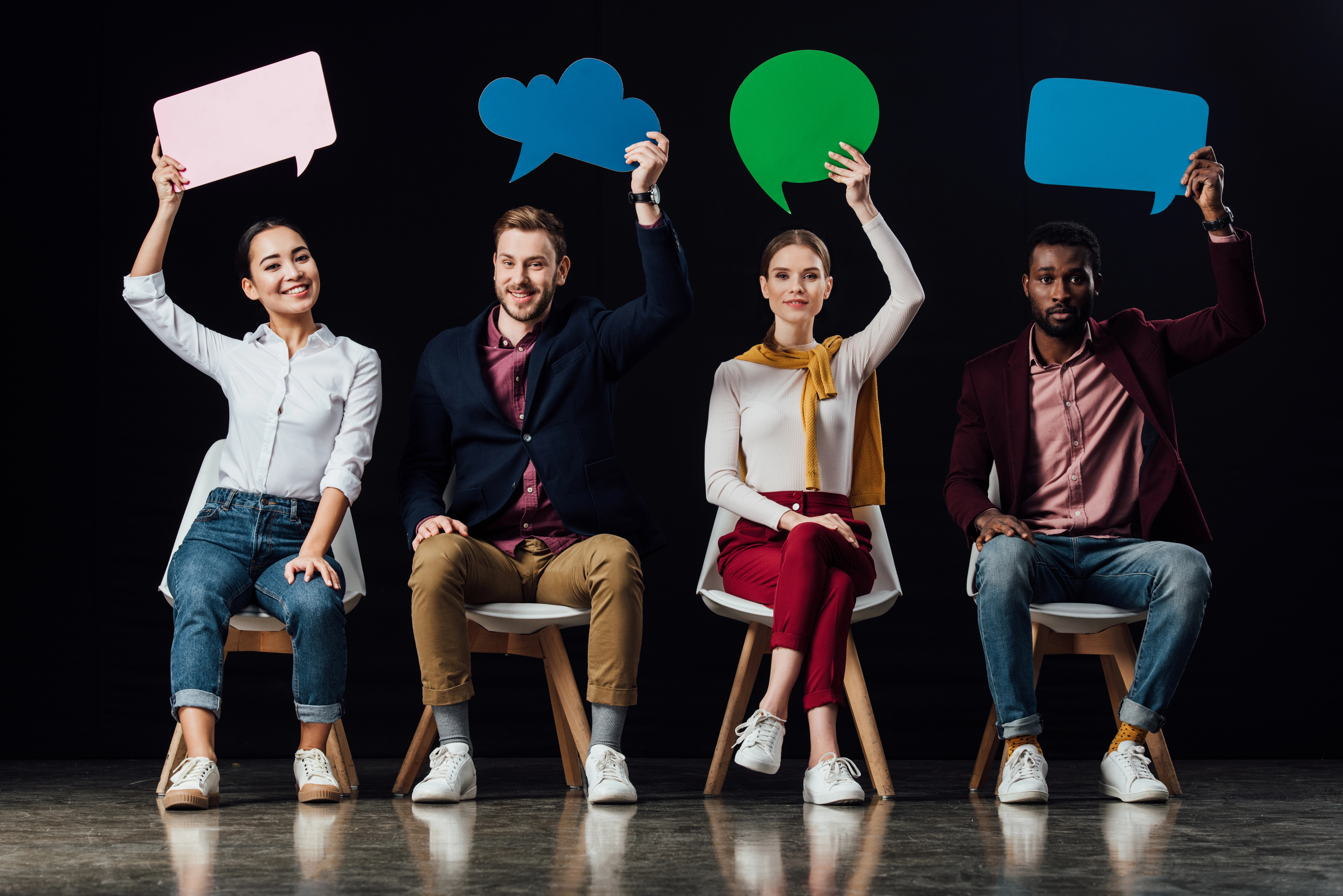 People holding speech bubbles